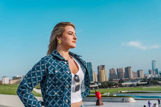 Woman looking out over a city skyline